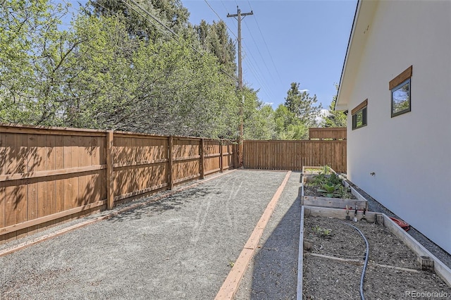6102 S Aberdeen St, Littleton, CO 80120 - fenced backyard featuring a vegetable garden