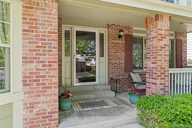 20922 E Crestline Cir, Centennial, CO 80015 - property entrance featuring brick siding and covered porch
