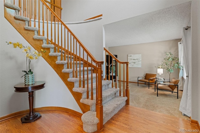 20922 E Crestline Cir, Centennial, CO 80015 - stairway featuring wood finished floors and baseboards