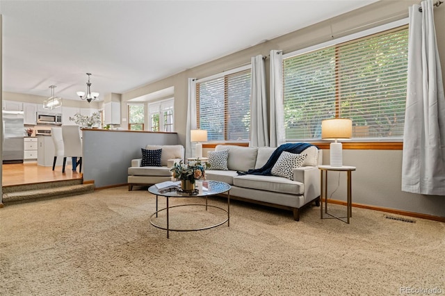 20922 E Crestline Cir, Centennial, CO 80015 - living area featuring baseboards, a chandelier, and carpet flooring