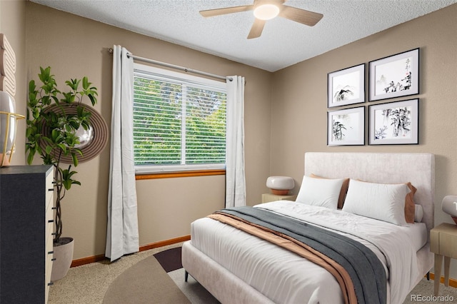 20922 E Crestline Cir, Centennial, CO 80015 - bedroom with a textured ceiling, carpet floors, baseboards, and a ceiling fan