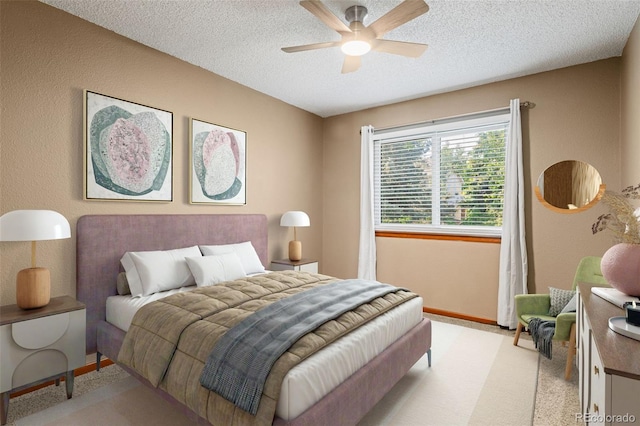20922 E Crestline Cir, Centennial, CO 80015 - bedroom featuring a textured ceiling, baseboards, light colored carpet, and ceiling fan