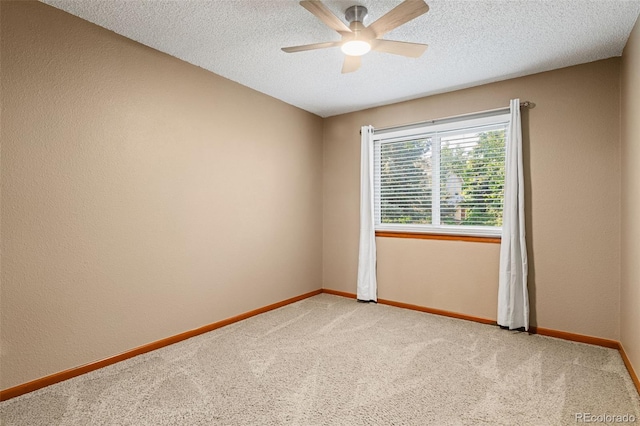 20922 E Crestline Cir, Centennial, CO 80015 - spare room featuring ceiling fan, light carpet, baseboards, and a textured ceiling