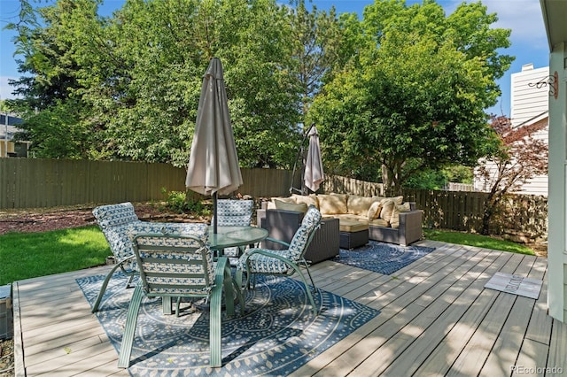 20922 E Crestline Cir, Centennial, CO 80015 - wooden terrace with outdoor dining area, an outdoor hangout area, and a fenced backyard