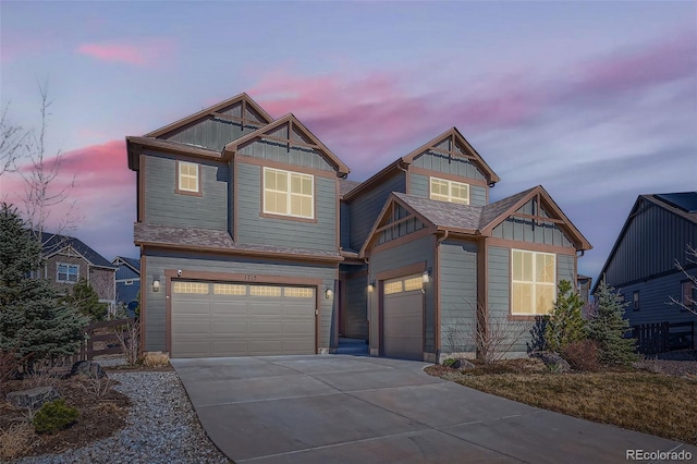 1715 Pioneer Cir, Lafayette, CO 80026 - craftsman inspired home featuring an attached garage, concrete driveway, and board and batten siding