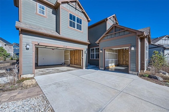 1715 Pioneer Cir, Lafayette, CO 80026 - view of front of property with concrete driveway, a garage, and board and batten siding