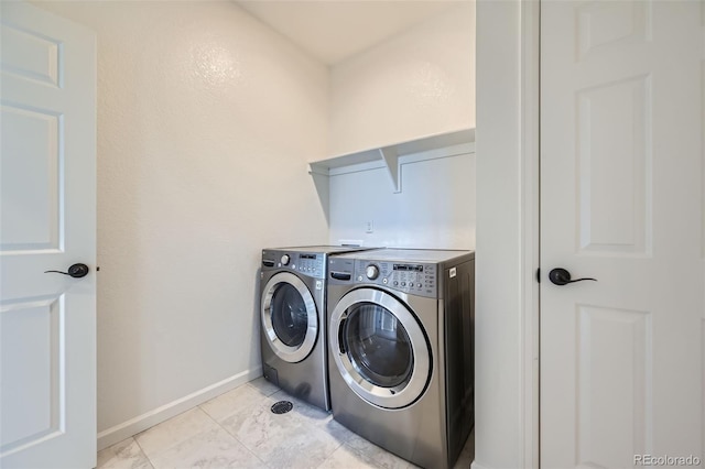 1715 Pioneer Cir, Lafayette, CO 80026 - laundry room featuring washing machine and clothes dryer and baseboards
