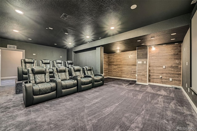 1715 Pioneer Cir, Lafayette, CO 80026 - cinema with carpet floors, a textured ceiling, baseboards, wooden walls, and recessed lighting