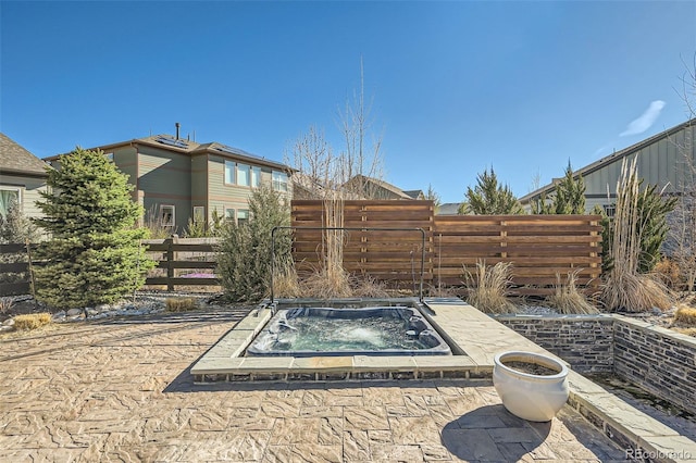 1715 Pioneer Cir, Lafayette, CO 80026 - view of patio featuring an in-ground hot tub and a fenced backyard