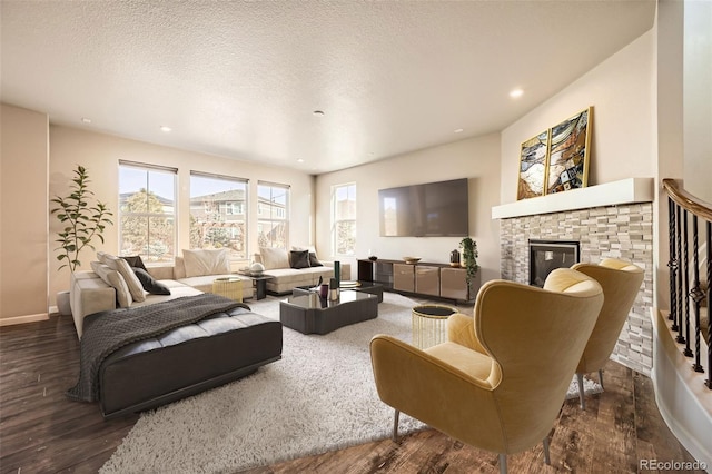 1715 Pioneer Cir, Lafayette, CO 80026 - living area with wood finished floors, a fireplace, baseboards, recessed lighting, and a textured ceiling