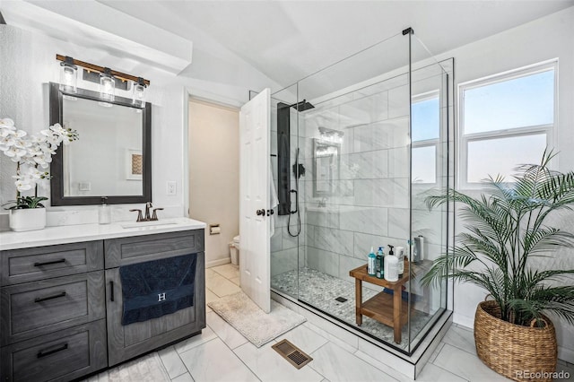 full bathroom with lofted ceiling, visible vents, toilet, a shower stall, and vanity