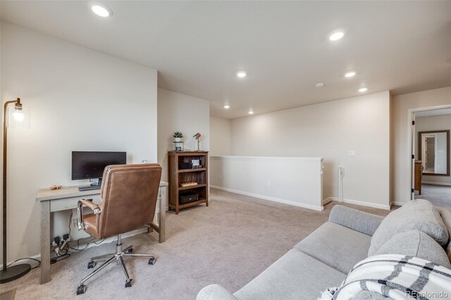 office space with light colored carpet, recessed lighting, and baseboards