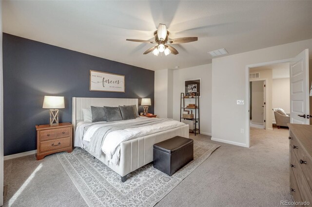 bedroom with light carpet, baseboards, and a ceiling fan