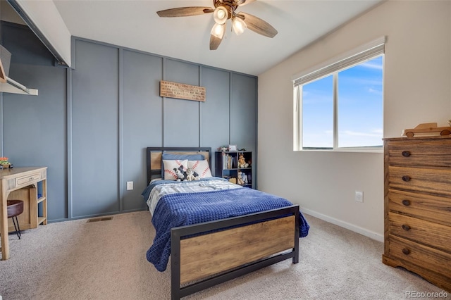 bedroom with carpet flooring, baseboards, and a ceiling fan