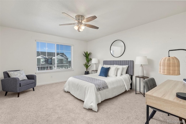 bedroom featuring ceiling fan and light carpet