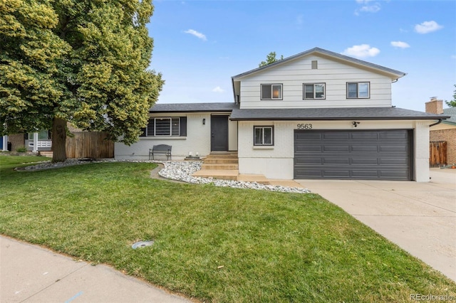 9563 W Caley Ave, Littleton, CO 80123 - split level home with an attached garage, concrete driveway, brick siding, and roof with shingles