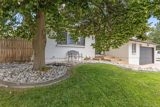 9563 W Caley Ave, Littleton, CO 80123 - view of yard with an attached garage