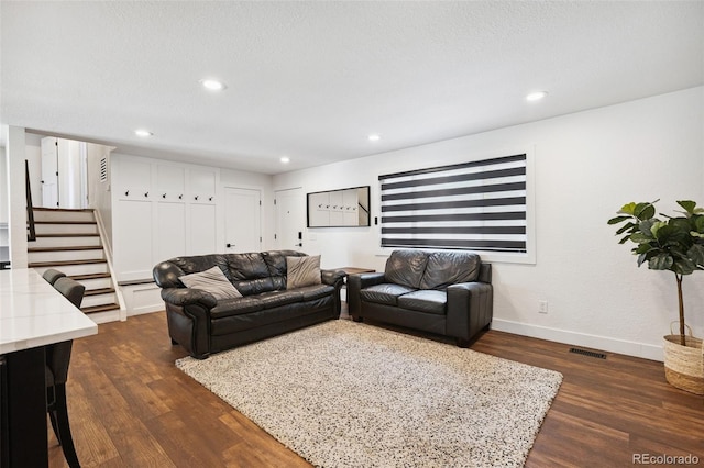 9563 W Caley Ave, Littleton, CO 80123 - living area featuring dark wood-type flooring, stairway, and recessed lighting