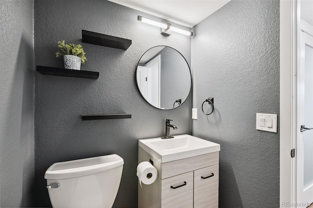9563 W Caley Ave, Littleton, CO 80123 - half bathroom featuring toilet and vanity