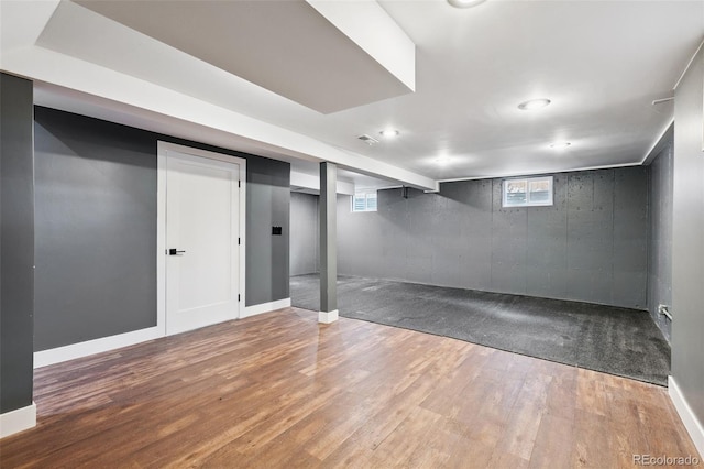 9563 W Caley Ave, Littleton, CO 80123 - below grade area with plenty of natural light, wood finished floors, and recessed lighting