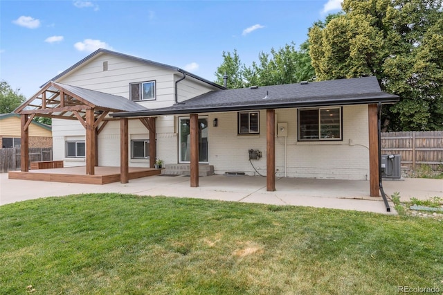 9563 W Caley Ave, Littleton, CO 80123 - view of front facade featuring brick siding, a patio area, a gazebo, and a deck