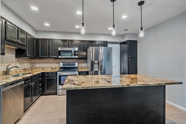 kitchen with decorative backsplash, light tile patterned floors, a sink, and stainless steel appliances