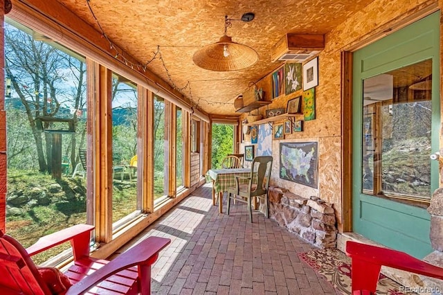 8929 Apache Dr, Beulah, CO 81023 - sunroom / solarium featuring brick floors