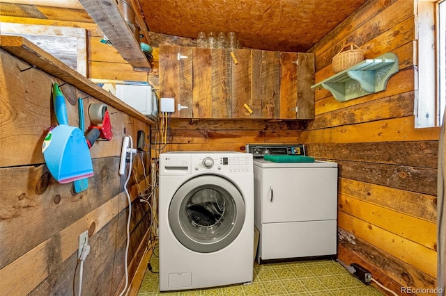 8929 Apache Dr, Beulah, CO 81023 - laundry area with wooden walls and washing machine and clothes dryer