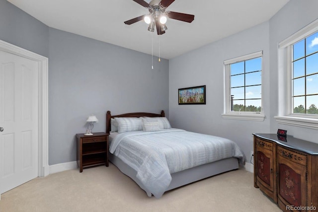 5171 Shade Tree Ln, Parker, CO 80134 - bedroom with multiple windows, light carpet, and ceiling fan