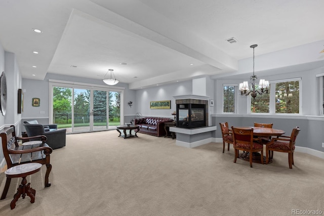 5171 Shade Tree Ln, Parker, CO 80134 - living area with light colored carpet, a multi sided fireplace, recessed lighting, and a chandelier
