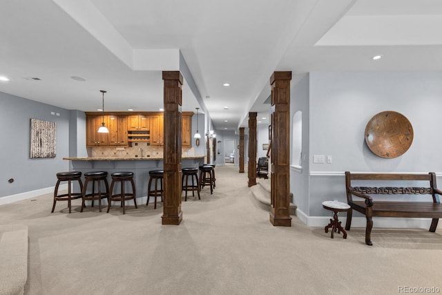 5171 Shade Tree Ln, Parker, CO 80134 - indoor wet bar featuring ornate columns, light carpet, recessed lighting, backsplash, and decorative light fixtures