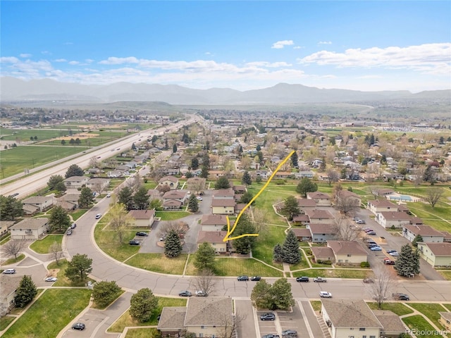 bird's eye view featuring a residential view and a mountain view