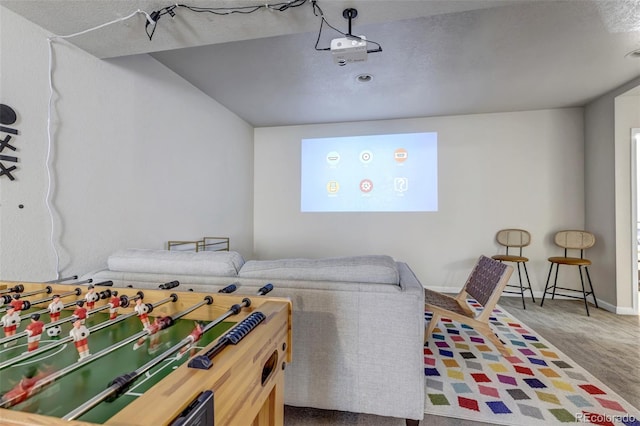 playroom featuring a textured ceiling and carpet floors