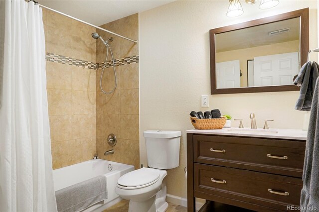 full bathroom with vanity, toilet, and shower / tub combo