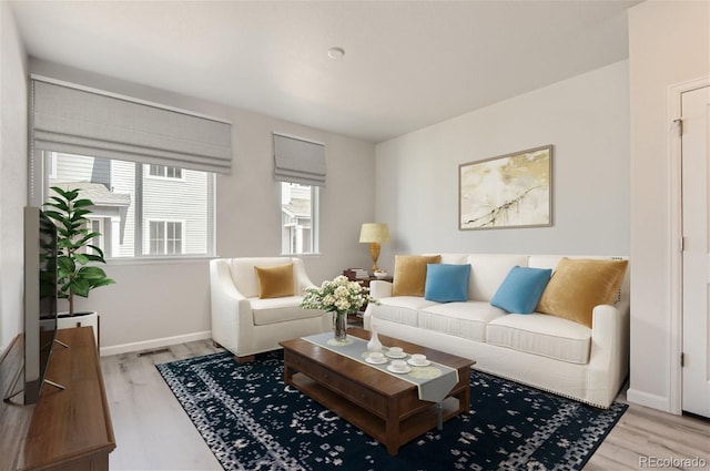 living room with light hardwood / wood-style flooring