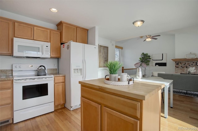 kitchen featuring butcher block countertops, open floor plan, recessed lighting, light wood-style flooring, and white appliances