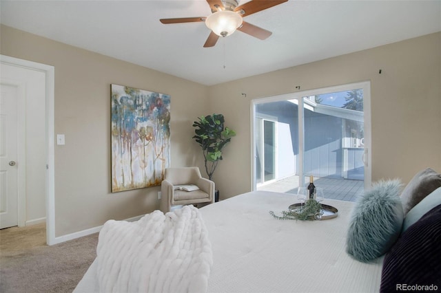 carpeted bedroom featuring ceiling fan, baseboards, and access to exterior