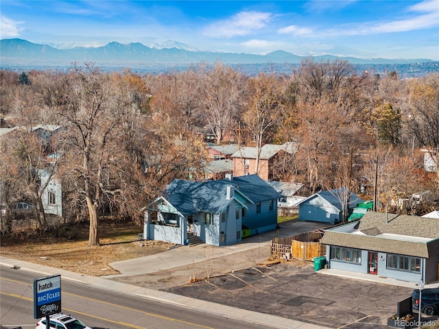 drone / aerial view featuring a residential view and a mountain view