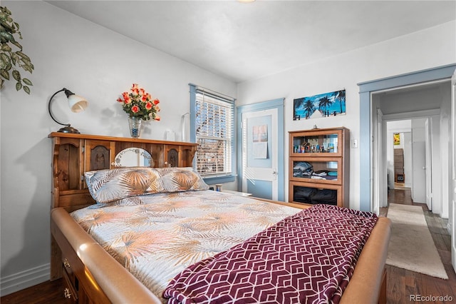 bedroom with wood-type flooring