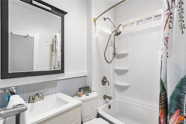 full bathroom featuring shower / bath combo, vanity, and toilet