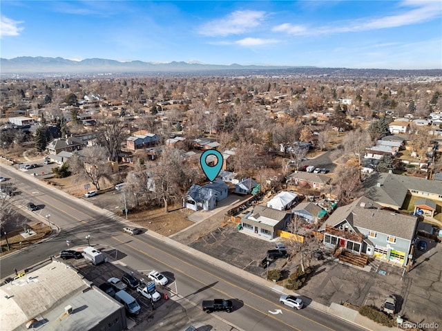 birds eye view of property with a mountain view