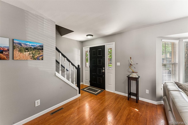 entryway with wood-type flooring