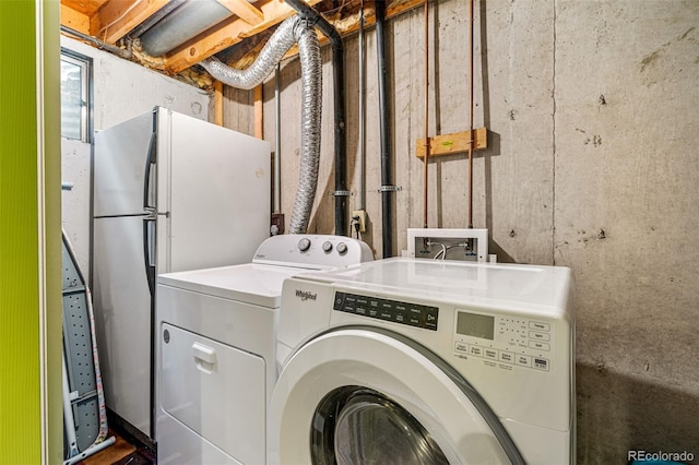 laundry area featuring independent washer and dryer