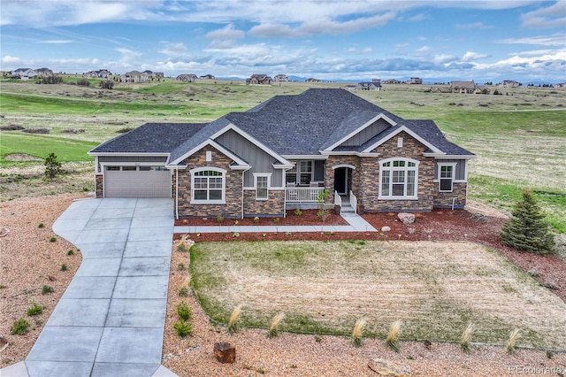 9727 Red Primrose St, Franktown, CO 80116 - craftsman inspired home with stone siding, board and batten siding, covered porch, and concrete driveway