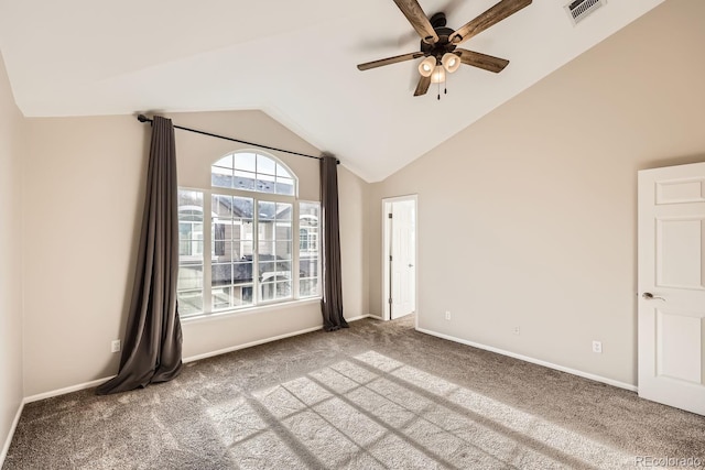 carpeted empty room featuring ceiling fan and lofted ceiling