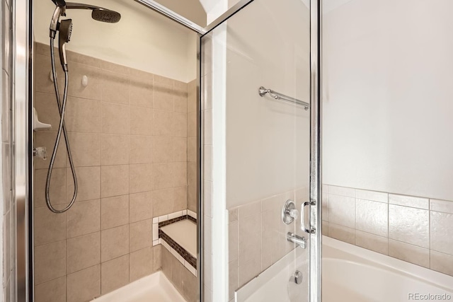 bathroom with separate shower and tub