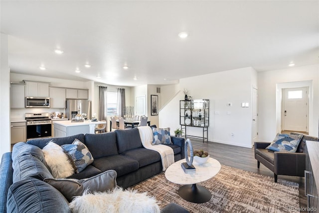 11782 Foraker Ln, Colorado Springs, CO 80925 - living room featuring dark wood finished floors, plenty of natural light, and recessed lighting