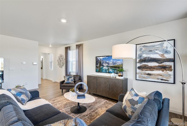 11782 Foraker Ln, Colorado Springs, CO 80925 - living room with wood finished floors and recessed lighting