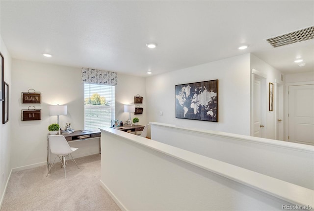 11782 Foraker Ln, Colorado Springs, CO 80925 - hallway with recessed lighting, light carpet, and an office area