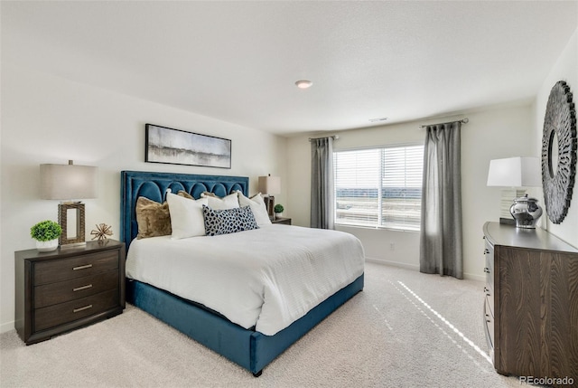 11782 Foraker Ln, Colorado Springs, CO 80925 - bedroom featuring light carpet and baseboards